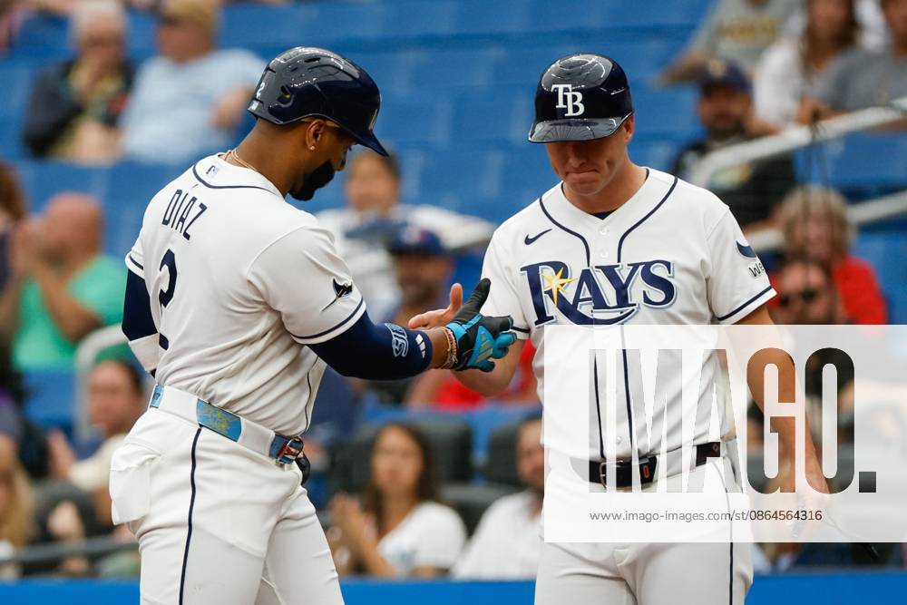 Tampa Bay Rays designated hitter Yandy DoÂaz (2) receives a high-five from first base coach Corey Dickerson (10), after he hits a single off of Toronto Blue Jays pitcher Shane Bieber (57) during the fourth inning at Tropicana Field on Thursday, Aug. 20, 2026, in St. Petersburg. St. Petersburg USA - ZUMAs70_ 20260820_zan_s70_022