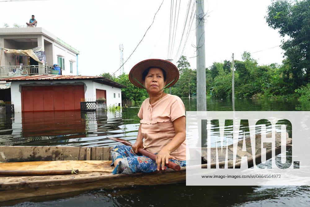 A woman navigates floodwaters by boat in Ngathaingchaung Township, Ayeyarwady Region, Myanmar..In Laymyethna Township, Ayeyarwady Region, the Ngawun River embankment collapsed on July 31, leaving nearby towns including Hinthada, Yegyi, Ngathaingchaung, Kyonpyaw and Kyaunggon still inundated for three weeks, affecting tens of thousands of people, officials said. Ngathaingchaung Myanmar - ZUMAn324 20260820_zip_n324_006