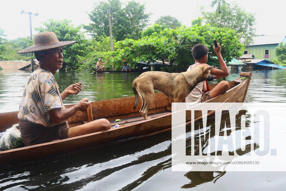People save a dog from floodwaters in Ngathaingchaung Township, Ayeyarwady Region, Myanmar..In Laymyethna Township, Ayeyarwady Region, the Ngawun River embankment collapsed on July 31, leaving nearby towns including Hinthada, Yegyi, Ngathaingchaung, Kyonpyaw and Kyaunggon still inundated for three weeks, affecting tens of thousands of people, officials said. Ngathaingchaung Myanmar - ZUMAn324 20260820_zip_n324_018