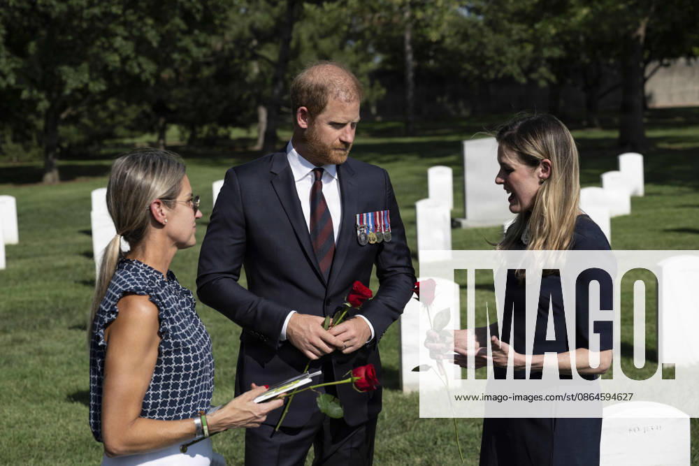 Britainâ€⠢s Prince Harry, speaks with Melissa and Becky Moriarty at the gravesite of their brother, U.S. Army Staff Sgt. James Moriarty, in Section 60 of Arlington National Cemetery, August 19, 2026 in Arlington, Virginia. Section 60 is the burial ground for service members killed in Afghanistan and Iraq. Arlington United States of America - ZUMAp138 20260821_zaa_p138_013