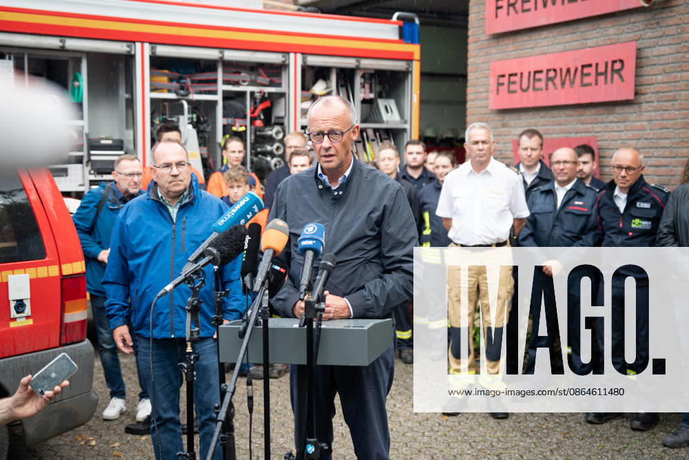 Visit by the Federal Chancellor to the Huertgenwald wildfire area: Federal Chancellor Friedrich Merz and District Administrator Dr. Ralf Nolten (left) during their joint press statement, with emergency responders in the background, as part of his visit to the Huertgenwald wildfire area to thank the emergency responders. Huertgenwald, August 22, 2026, Huertgenwald, North Rhine-Wes