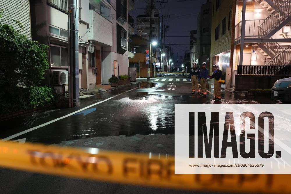 Strong earthquake hits Tokyo area A street is partially flooded in Tokyo in the early hours of Aug. 23, 2026, following the rupture of a water pipe triggered by a strong earthquake that struck eastern Japan. A14AA0005626416P