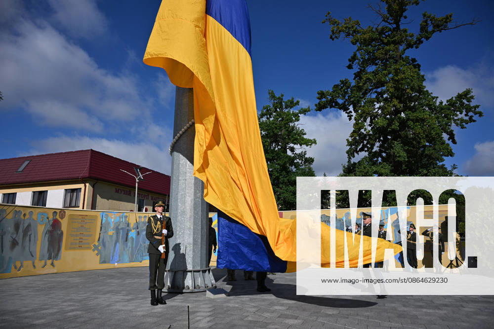 National Flag Day of Ukraine in Lviv LVIV, UKRAINE - AUGUST 23: Ukrainian servicemen hold a large national flag during a National Flag Day ceremony in Lviv, Ukraine, on August 23, 2026. Due to the ongoing Russian-Ukrainian War, celebrations were limited to a ceremonial raising of the Ukrainian flag on the city s highest flagpole with the participation of soldiers from various branches of the armed forces. Participants also observed a minute of silence for those killed, sang the Ukrainian national anthem, and listened to patriotic and folk songs performed by a military orchestra. Michael Sorrow Anadolu Lviv Ukraine. Editorial use only. Please get in touch for any other usage.