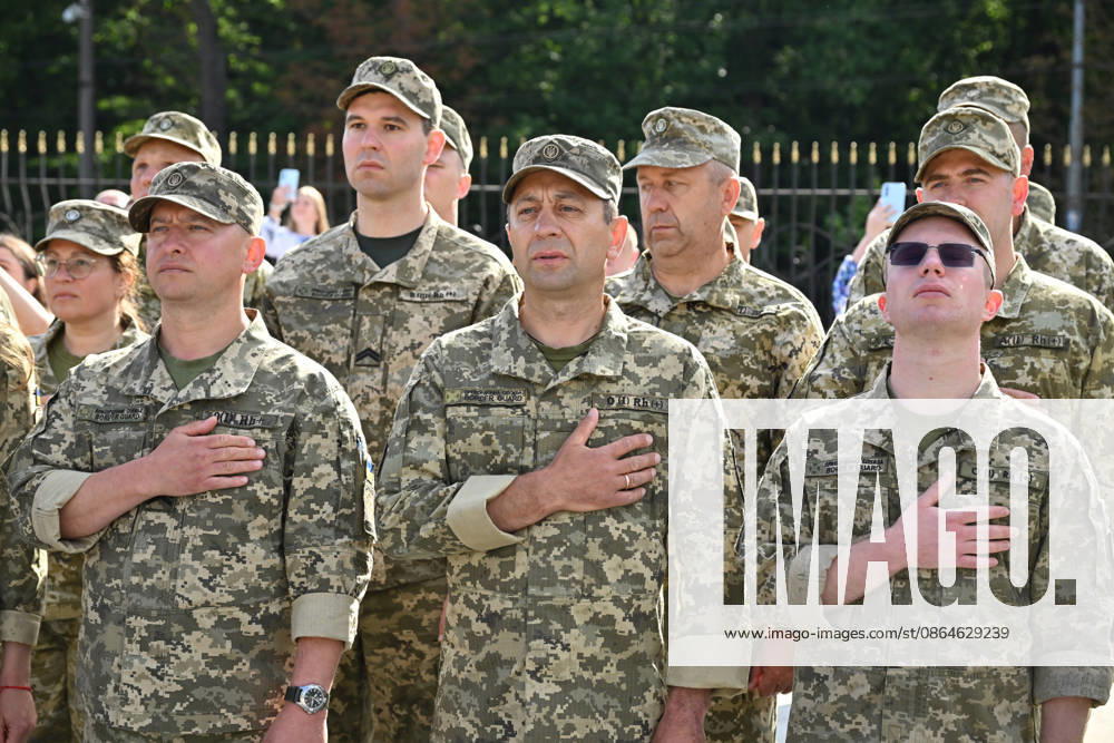 National Flag Day of Ukraine in Lviv LVIV, UKRAINE - AUGUST 23: Ukrainian servicemen place their hands over their hearts during a National Flag Day ceremony in Lviv, Ukraine, on August 23, 2026. Due to the ongoing Russian-Ukrainian War, celebrations were limited to a ceremonial raising of the Ukrainian flag on the city s highest flagpole with the participation of soldiers from various branches of the armed forces. Participants also observed a minute of silence for those killed, sang the Ukrainian national anthem, and listened to patriotic and folk songs performed by a military orchestra. Michael Sorrow Anadolu Lviv Ukraine. Editorial use only. Please get in touch for any other usage.