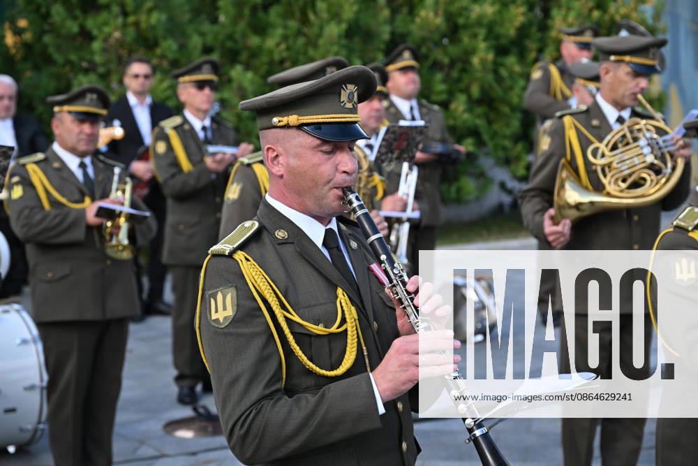National Flag Day of Ukraine in Lviv LVIV, UKRAINE - AUGUST 23: A member of a Ukrainian military orchestra performs during a National Flag Day ceremony in Lviv, Ukraine, on August 23, 2026. Due to the ongoing Russian-Ukrainian War, celebrations were limited to a ceremonial raising of the Ukrainian flag on the city s highest flagpole with the participation of soldiers from various branches of the armed forces. Participants also observed a minute of silence for those killed, sang the Ukrainian national anthem, and listened to patriotic and folk songs performed by a military orchestra. Michael Sorrow Anadolu Lviv Ukraine. Editorial use only. Please get in touch for any other usage.