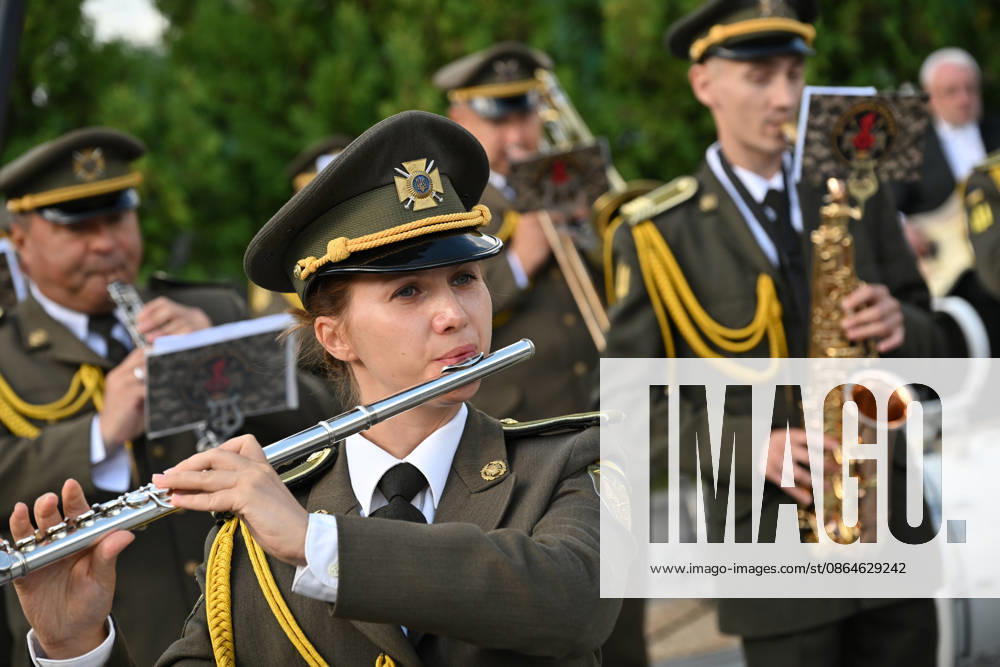National Flag Day of Ukraine in Lviv LVIV, UKRAINE - AUGUST 23: A member of a Ukrainian military orchestra performs during a National Flag Day ceremony in Lviv, Ukraine, on August 23, 2026. Due to the ongoing Russian-Ukrainian War, celebrations were limited to a ceremonial raising of the Ukrainian flag on the city s highest flagpole with the participation of soldiers from various branches of the armed forces. Participants also observed a minute of silence for those killed, sang the Ukrainian national anthem, and listened to patriotic and folk songs performed by a military orchestra. Michael Sorrow Anadolu Lviv Ukraine. Editorial use only. Please get in touch for any other usage.