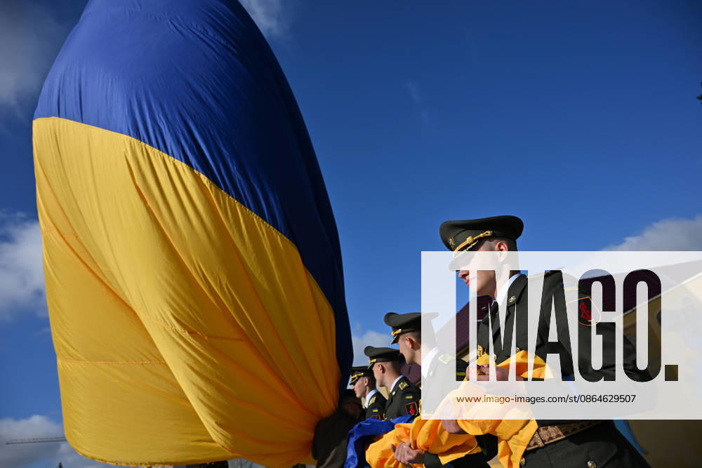 National Flag Day of Ukraine in Lviv LVIV, UKRAINE - AUGUST 23: Celebration of the National Flag Day of Ukraine during the Russian-Ukrainian War in Lviv, Ukraine on August 23, 2026. Due to the war, only the ceremonial raising of the Ukrainian flag on the highest flagpole in the city with the participation of soldiers from various branches of the armed forces took place. People also honored the fallen with a minute of silence, sang the Ukrainian anthem, and a military orchestra played several patriotic and folk songs. Michael Sorrow Anadolu Lviv Ukraine. Editorial use only. Please get in touch for any other usage.