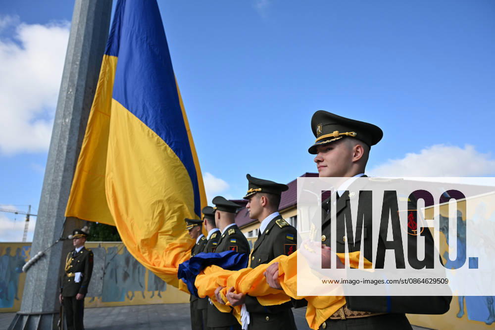 National Flag Day of Ukraine in Lviv LVIV, UKRAINE - AUGUST 23: Celebration of the National Flag Day of Ukraine during the Russian-Ukrainian War in Lviv, Ukraine on August 23, 2026. Due to the war, only the ceremonial raising of the Ukrainian flag on the highest flagpole in the city with the participation of soldiers from various branches of the armed forces took place. People also honored the fallen with a minute of silence, sang the Ukrainian anthem, and a military orchestra played several patriotic and folk songs. Michael Sorrow Anadolu Lviv Ukraine. Editorial use only. Please get in touch for any other usage.