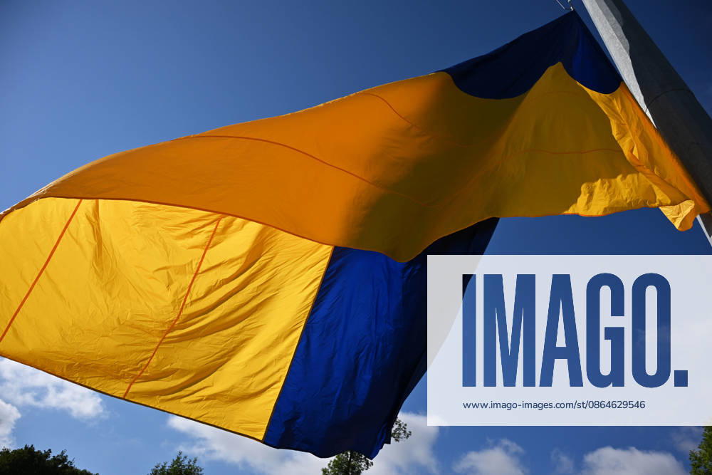 National Flag Day of Ukraine in Lviv LVIV, UKRAINE - AUGUST 23: Celebration of the National Flag Day of Ukraine during the Russian-Ukrainian War in Lviv, Ukraine on August 23, 2026. Due to the war, only the ceremonial raising of the Ukrainian flag on the highest flagpole in the city with the participation of soldiers from various branches of the armed forces took place. People also honored the fallen with a minute of silence, sang the Ukrainian anthem, and a military orchestra played several patriotic and folk songs. Michael Sorrow Anadolu Lviv Ukraine. Editorial use only. Please get in touch for any other usage.