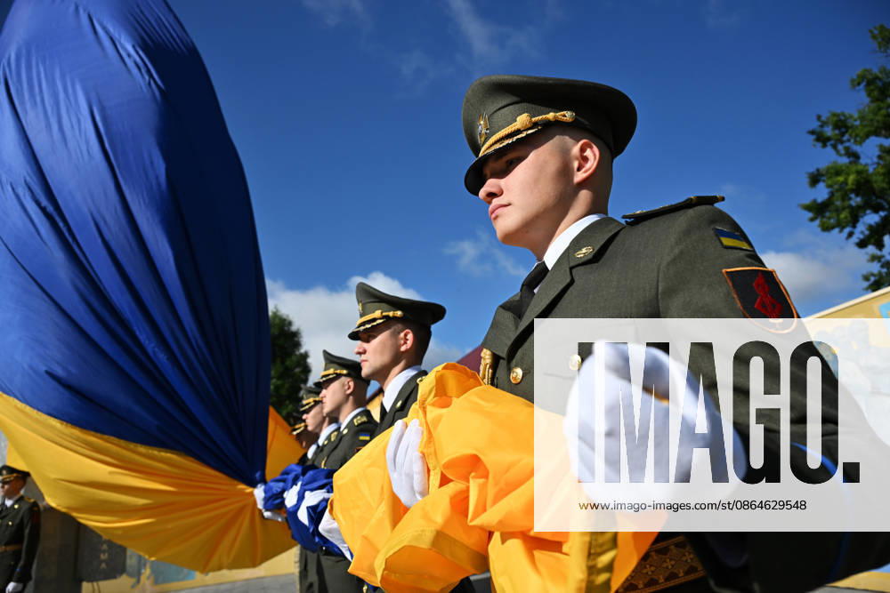 National Flag Day of Ukraine in Lviv LVIV, UKRAINE - AUGUST 23: Celebration of the National Flag Day of Ukraine during the Russian-Ukrainian War in Lviv, Ukraine on August 23, 2026. Due to the war, only the ceremonial raising of the Ukrainian flag on the highest flagpole in the city with the participation of soldiers from various branches of the armed forces took place. People also honored the fallen with a minute of silence, sang the Ukrainian anthem, and a military orchestra played several patriotic and folk songs. Michael Sorrow Anadolu Lviv Ukraine. Editorial use only. Please get in touch for any other usage.