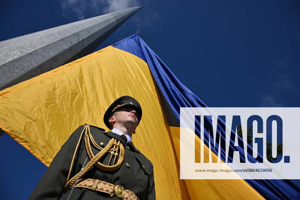 National Flag Day of Ukraine in Lviv LVIV, UKRAINE - AUGUST 23: Celebration of the National Flag Day of Ukraine during the Russian-Ukrainian War in Lviv, Ukraine on August 23, 2026. Due to the war, only the ceremonial raising of the Ukrainian flag on the highest flagpole in the city with the participation of soldiers from various branches of the armed forces took place. People also honored the fallen with a minute of silence, sang the Ukrainian anthem, and a military orchestra played several patriotic and folk songs. Michael Sorrow Anadolu Lviv Ukraine. Editorial use only. Please get in touch for any other usage.