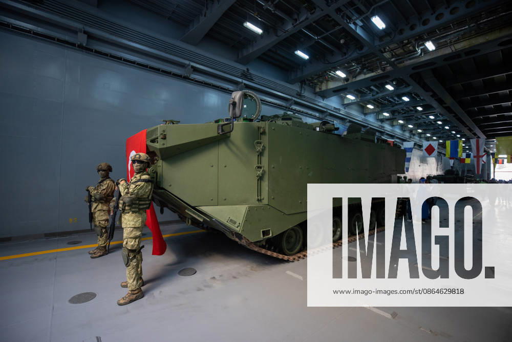 TEKNOFEST Blue Homeland KOCAELI, TURKIYE - AUGUST 23: Turkish soldiers stand guard beside a Turkish flag and an armored military vehicle displayed during TEKNOFEST Blue Homeland at the Golcuk Naval Shipyard Command in Kocaeli, Turkiye, on August 23, 2026. TCG Sancaktar carries out military missions including amphibious operations and mine-laying, and can also serve as a hospital, logistics support and evacuation ship in disaster zones. The event, organized under the leadership of the Turkish Ministry of National Defense and the Turkish Technology Team Foundation (T3 Foundation), with Anadolu serving as its Global Communication Partner, continues on its final day. Ibrahim Yozoglu Anadolu Kocaeli Turkey. Editorial use only. Please get in to