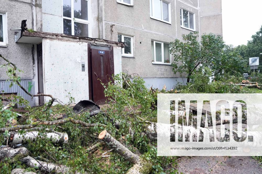 Riga, Latvija: The aftermath of a powerful storm is seen in Riga, Latvia, Aug. 23, 2026. Fallen and uprooted trees are scattered across residential areas, damaging parked cars, blocking roads and walkways, and posing a threat to nearby buildings. The storm, which swept across Latvia on Saturday evening and overnight, caused widespread damage across the country, with Riga recording the highest number of reports of storm-related incidents. As of Sunday morning, emergency services had received nearly 1,900 reports of damage caused by strong winds nationwide. Riga Latvija - ZUMAp305 20260823_zip_p305_002