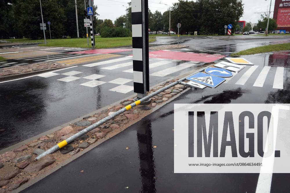 Riga, Latvija: The aftermath of a powerful storm is seen in Riga, Latvia, Aug. 23, 2026. Fallen and uprooted trees are scattered across residential areas, damaging parked cars, blocking roads and walkways, and posing a threat to nearby buildings. The storm, which swept across Latvia on Saturday evening and overnight, caused widespread damage across the country, with Riga recording the highest number of reports of storm-related incidents. As of Sunday morning, emergency services had received nearly 1,900 reports of damage caused by strong winds nationwide. Riga Latvija - ZUMAp305 20260823_zip_p305_018