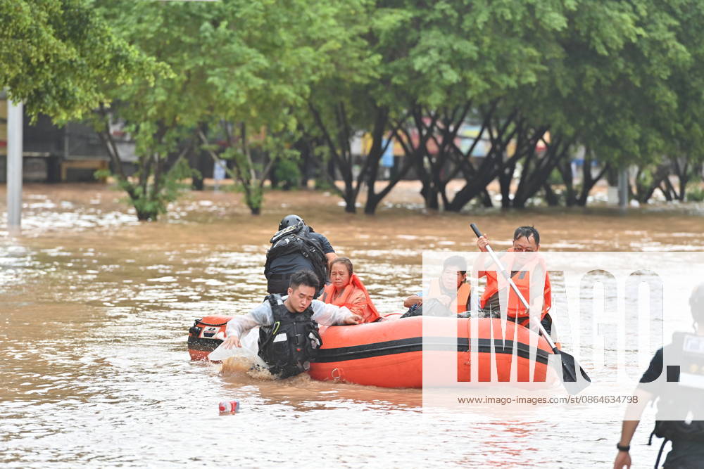 (260823) -- NINGMING, Aug. 23, 2026 -- Rescuers transfer stranded residents in Ningming County, south China s Guangxi Zhuang Autonomous Region, Aug. 23, 2026. For days, Ningming County has been battered by typhoon-triggered heavy rainfall. Response forces have pooled their efforts to urgently evacuate stranded residents. ) CHINA-GUANGXI-TYPHOON-STRANDED RESIDENTS-TRANSFER (CN) ZhouxHua