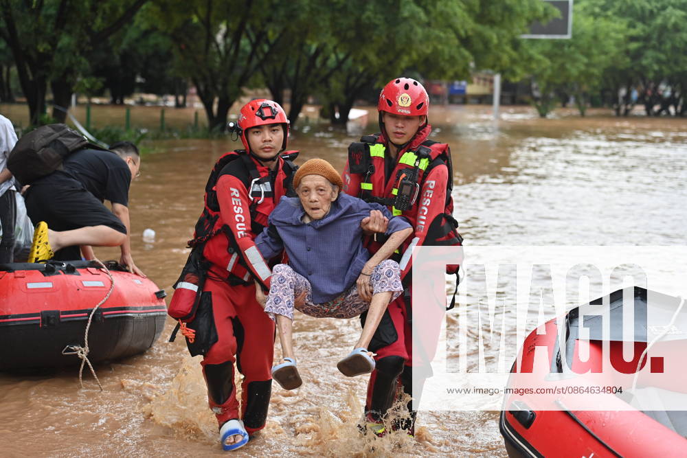 (260823) -- NINGMING, Aug. 23, 2026 -- Rescuers transfer a stranded resident in Ningming County, south China s Guangxi Zhuang Autonomous Region, Aug. 23, 2026. For days, Ningming County has been battered by typhoon-triggered heavy rainfall. Response forces have pooled their efforts to urgently evacuate stranded residents. ) CHINA-GUANGXI-TYPHOON-STRANDED RESIDENTS-TRANSFER (CN) ZhouxHua