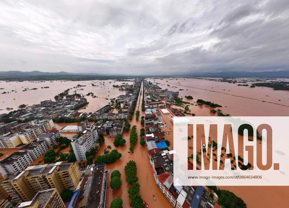 (260823) -- NINGMING, Aug. 23, 2026 -- An aerial drone photo taken on Aug. 23, 2026 shows a view of Ningming County, in south China s Guangxi Zhuang Autonomous Region. For days, Ningming County has been battered by typhoon-triggered heavy rainfall. Response forces have pooled their efforts to urgently evacuate stranded residents. ) CHINA-GUANGXI-TYPHOON-STRANDED RESIDENTS-TRANSFER (CN) ZhouxHua