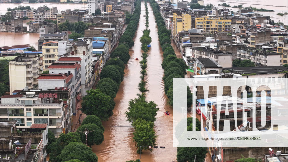 (260823) -- NINGMING, Aug. 23, 2026 -- An aerial drone photo taken on Aug. 23, 2026 shows a view of Ningming County, in south China s Guangxi Zhuang Autonomous Region. For days, Ningming County has been battered by typhoon-triggered heavy rainfall. Response forces have pooled their efforts to urgently evacuate stranded residents. ) CHINA-GUANGXI-TYPHOON-STRANDED RESIDENTS-TRANSFER (CN) ZhouxHua
