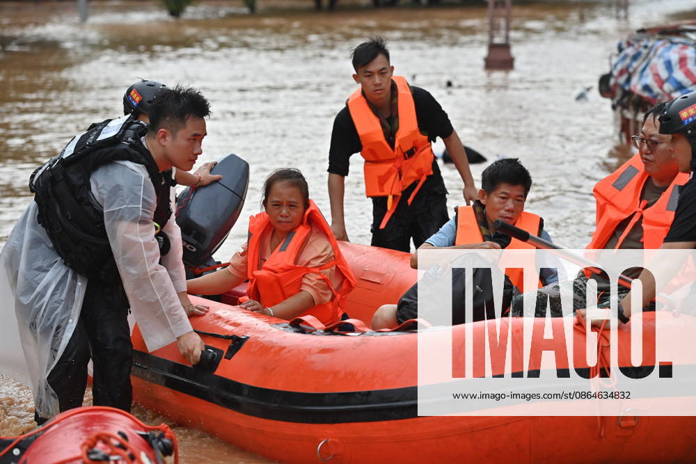 (260823) -- NINGMING, Aug. 23, 2026 -- Rescuers transfer stranded residents in Ningming County, south China s Guangxi Zhuang Autonomous Region, Aug. 23, 2026. For days, Ningming County has been battered by typhoon-triggered heavy rainfall. Response forces have pooled their efforts to urgently evacuate stranded residents. ) CHINA-GUANGXI-TYPHOON-STRANDED RESIDENTS-TRANSFER (CN) ZhouxHua