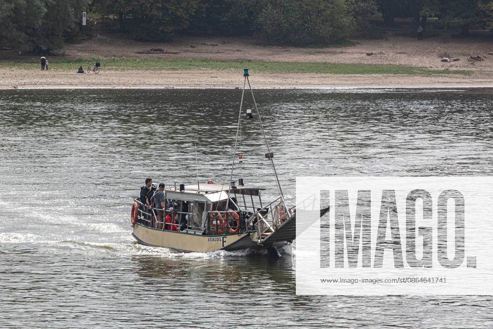 A passenger ferry transports passengers across the Rhine between Cologne-Weiss and Zündorf. Service had been temporarily suspended due to low water levels. Rhine ferry