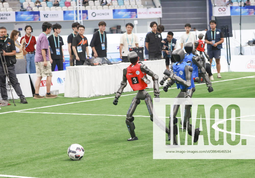 Robot players compete in the quarterfinal match of the soccer event - 5v5 Large Size Group on day 2 of the 2nd World Humanoid Robot Games at National Speed Skating Oval on August 23, 2026 in Beijing, China.