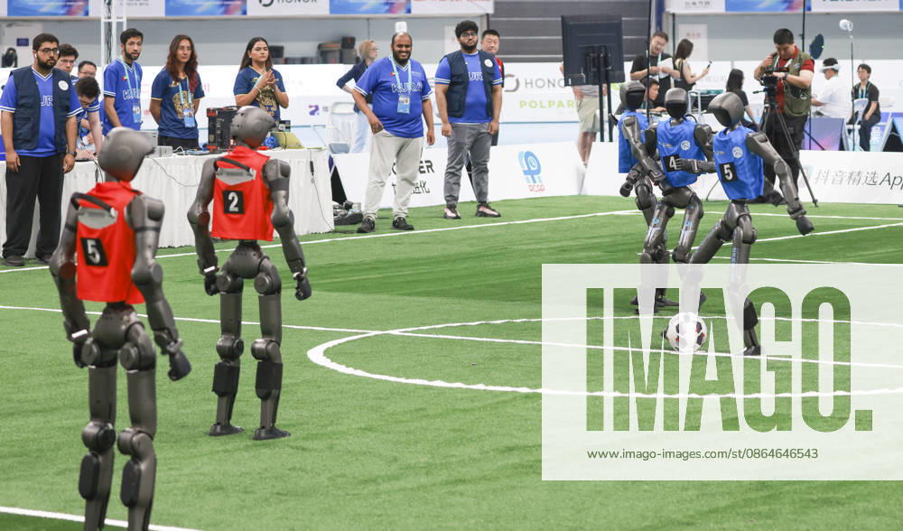 Robot players compete in the quarterfinal match of the soccer event - 5v5 Large Size Group on day 2 of the 2nd World Humanoid Robot Games at National Speed Skating Oval on August 23, 2026 in Beijing, China.