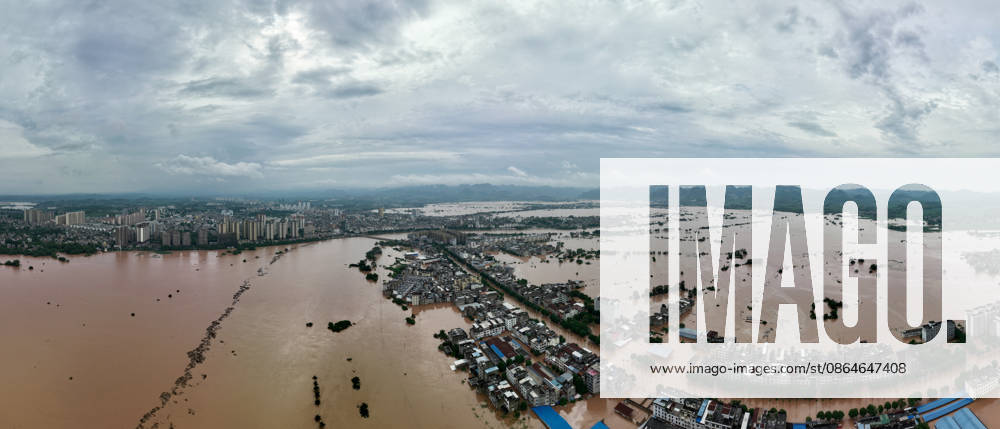 Residents evacuate in an orderly manner as flooding hits Chengzhong Town in Ningming County on August 23, 2026 in Chongzuo, Guangxi Zhuang Autonomous Region of China. The local area experienced flooding due to the impact of a typhoon.