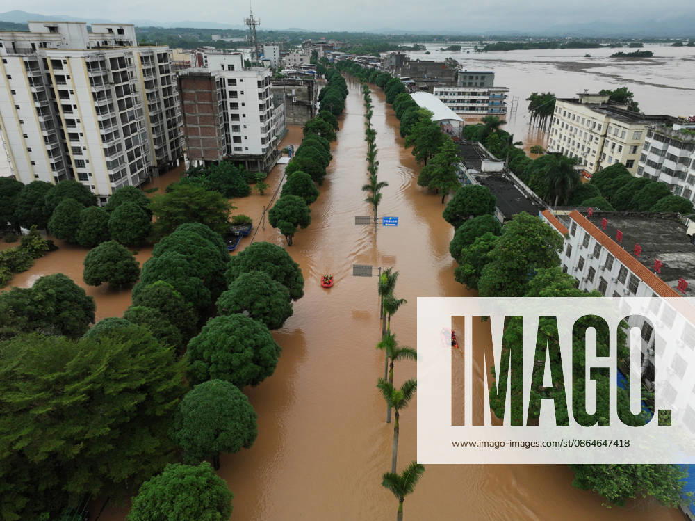 Residents evacuate in an orderly manner as flooding hits Chengzhong Town of Ningming County due to a typhoon on August 23, 2026 in Ningming, Guangxi Zhuang Autonomous Region of China.