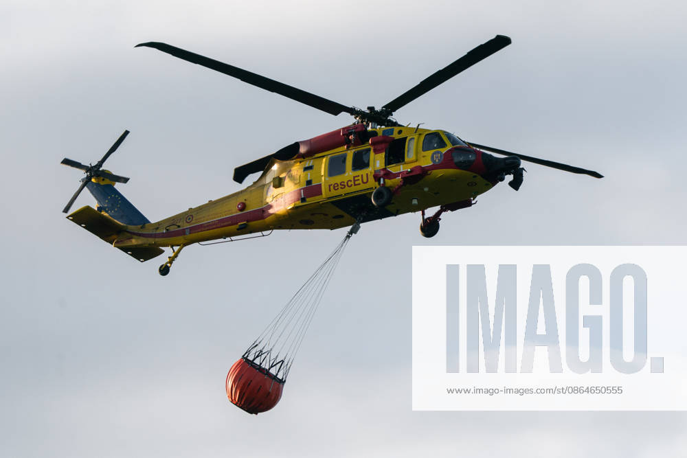 2026823, Kajtasovo, Serbia -The European Union is actively assisting Serbia in battling severe wildfires at Serbia s request through the EU Civil Protection Mechanism, deploying four firefighting helicopters from Romania, Slovakia, the Czech Republic, and Germany, alongside ground response teams to contain large blazes like the one in the Deliblato Sands. A Romanian rescEU Black Hawk helicopter. Kajtasovo Serbia - ZUMAd223 20260824_zip_d223_002