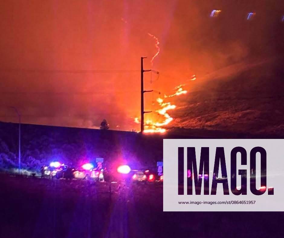 Fast-moving Hawk Fire threatens Reno, forcing thousands to evacuate RENO, NEVADA, UNITED STATES - AUGUST 23: (---- - MANDATORY CREDIT - WASHOE COUNTY SHERIFF S OFFICE HANDOUT - NO MARKETING NO ADVERTISING CAMPAIGNS - DISTRIBUTED AS A SERVICE TO CLIENTS----) Flames and smoke rise from the Hawk Fire as emergency vehicles are seen near the wildfire northwest of Reno, Nevada, United States, on August 23, 2026. The fast-moving wildfire prompted evacuation orders and warnings for thousands of residents as crews worked to contain the blaze. Washoe County Sheriff s Office Handout Anadolu Reno United States. Editorial use only. Please get in touch for any other usage.