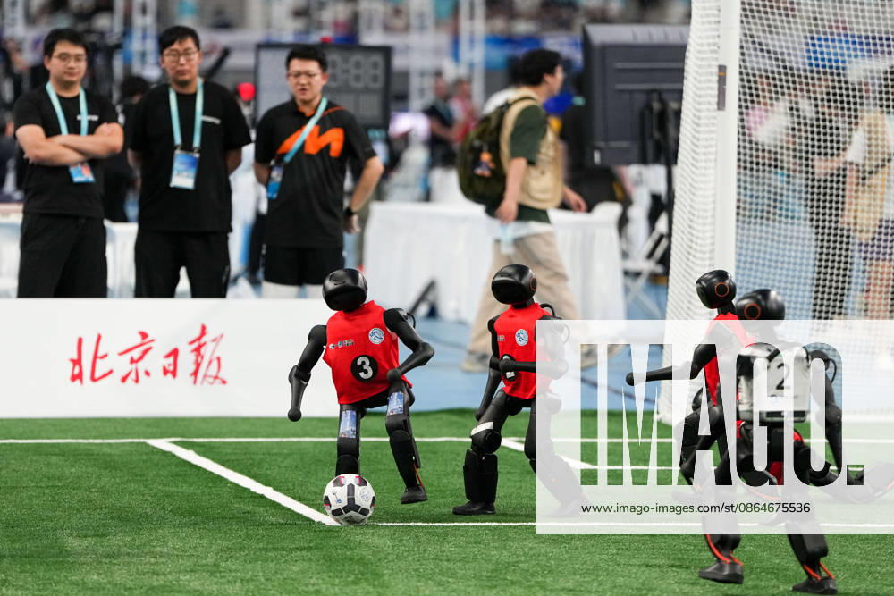 (260824) -- BEIJING, Aug. 24, 2026 -- Robots (L) of CAU Mountain&Sea competes with robots of B-human during the 5v5 Medium Robot Group of Soccer match of the 2nd World Humanoid Robot Games in Beijing, capital of China, Aug. 24, 2026. ) (SP)CHINA-BEIJING-WORLD HUMANOID ROBOT GAMES (CN) JuxHuanzong