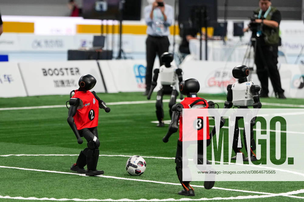 (260824) -- BEIJING, Aug. 24, 2026 -- Robots (L) of CAU Mountain&Sea competes with robots of B-human during the 5v5 Medium Robot Group of Soccer match of the 2nd World Humanoid Robot Games in Beijing, capital of China, Aug. 24, 2026. ) (SP)CHINA-BEIJING-WORLD HUMANOID ROBOT GAMES (CN) JuxHuanzong