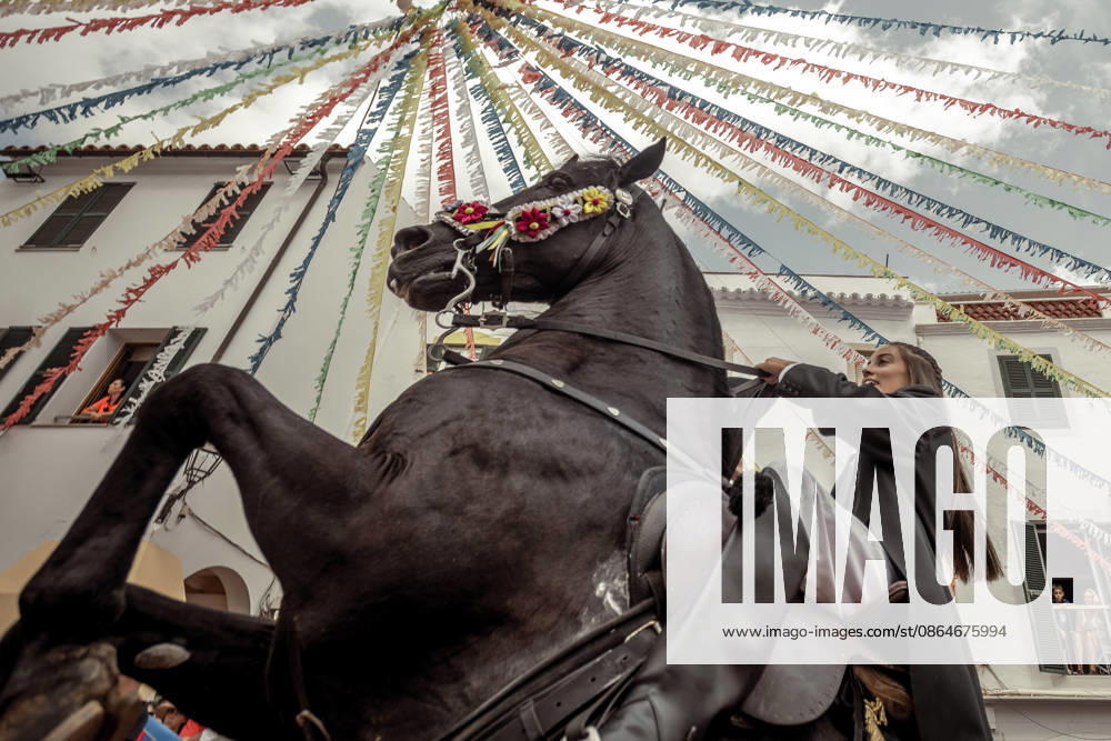 A caixer, or horse rider, rears his horse amid a cheering crowd during the traditional Jaleo at the Sant Bartomeu Festival in Ferreries. Ferreries Spain - ZUMAo105 20260824_fap_o105_014