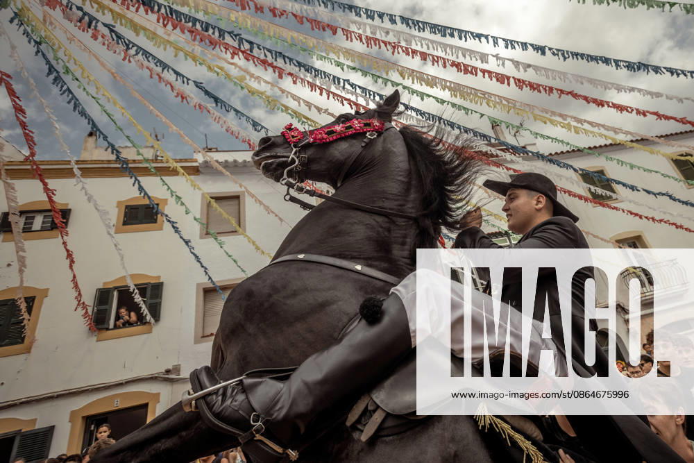 A caixer, or horse rider, rears his horse amid a cheering crowd during the traditional Jaleo at the Sant Bartomeu Festival in Ferreries. Ferreries Spain - ZUMAo105 20260824_fap_o105_015
