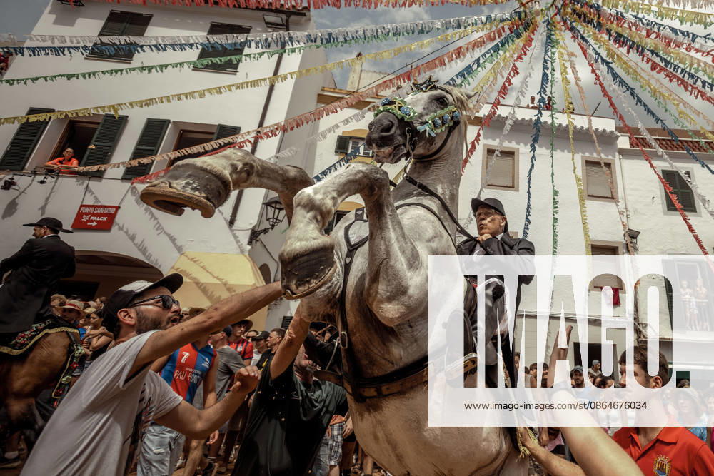 A caixer, or horse rider, rears his horse amid a cheering crowd during the traditional Jaleo at the Sant Bartomeu Festival in Ferreries. Ferreries Spain - ZUMAo105 20260824_fap_o105_020