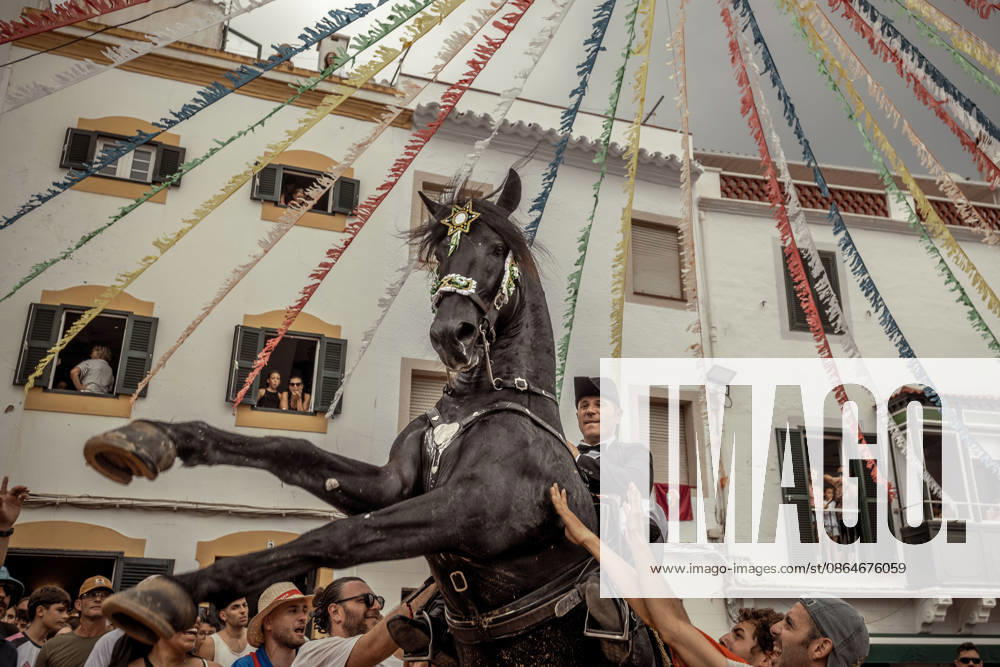 A caixer, or horse rider, rears his horse amid a cheering crowd during the traditional Jaleo at the Sant Bartomeu Festival in Ferreries. Ferreries Spain - ZUMAo105 20260824_fap_o105_031