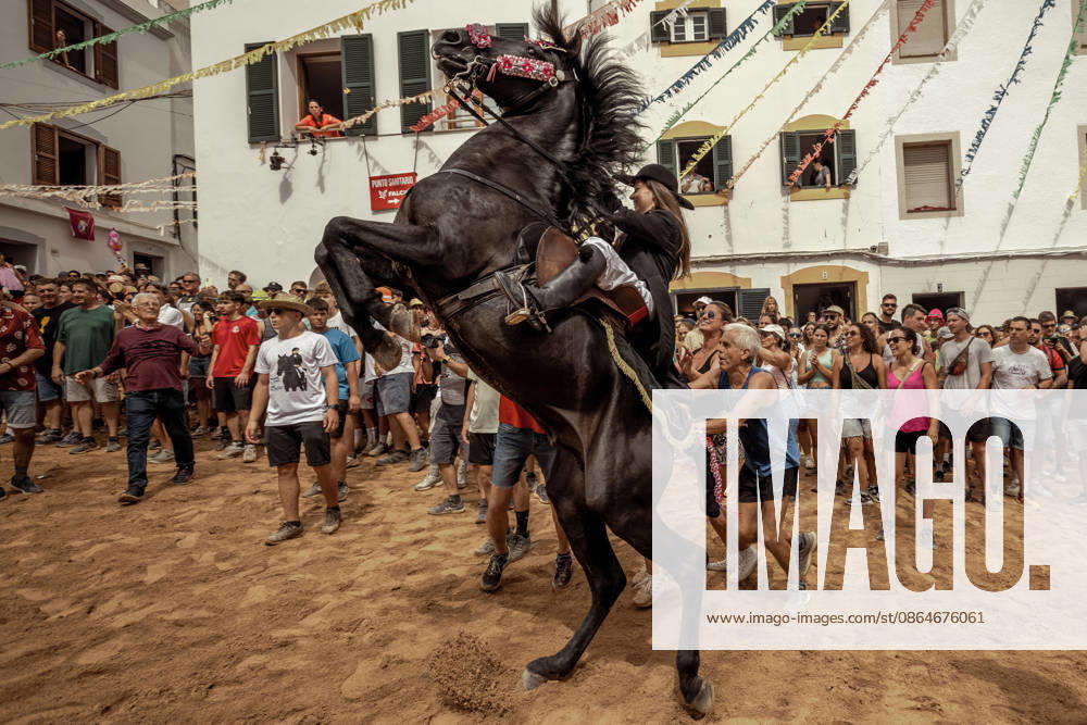 A caixer, or horse rider, rears his horse amid a cheering crowd during the traditional Jaleo at the Sant Bartomeu Festival in Ferreries. Ferreries Spain - ZUMAo105 20260824_fap_o105_035