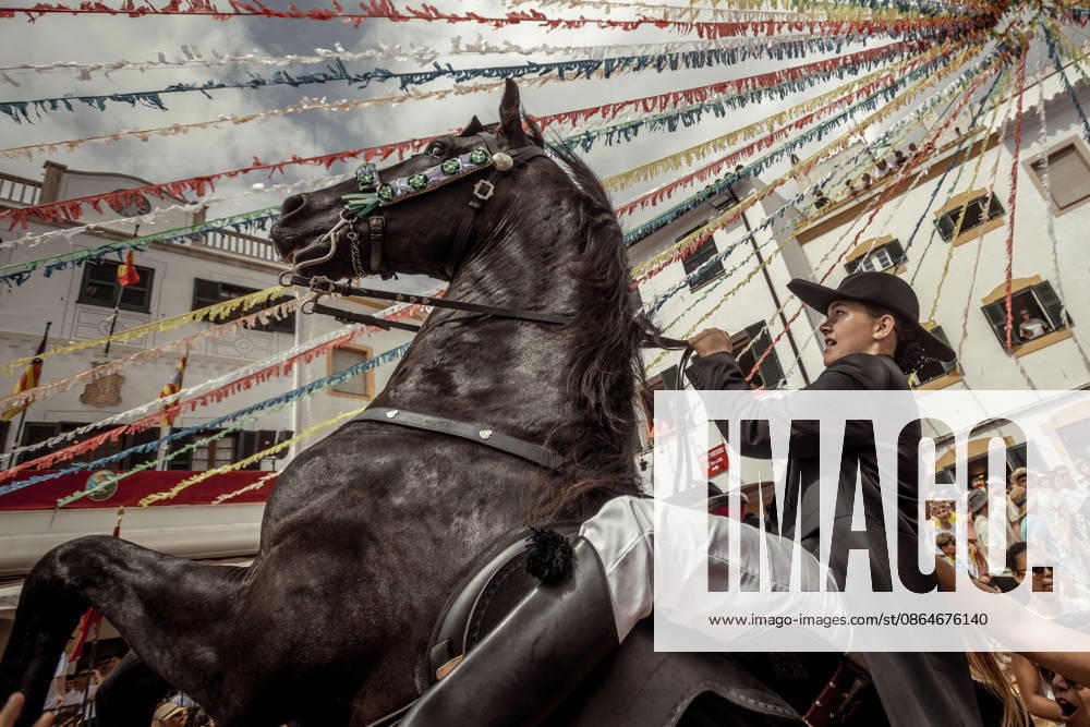 A caixer, or horse rider, rears his horse amid a cheering crowd during the traditional Jaleo at the Sant Bartomeu Festival in Ferreries. Ferreries Spain - ZUMAo105 20260824_fap_o105_034