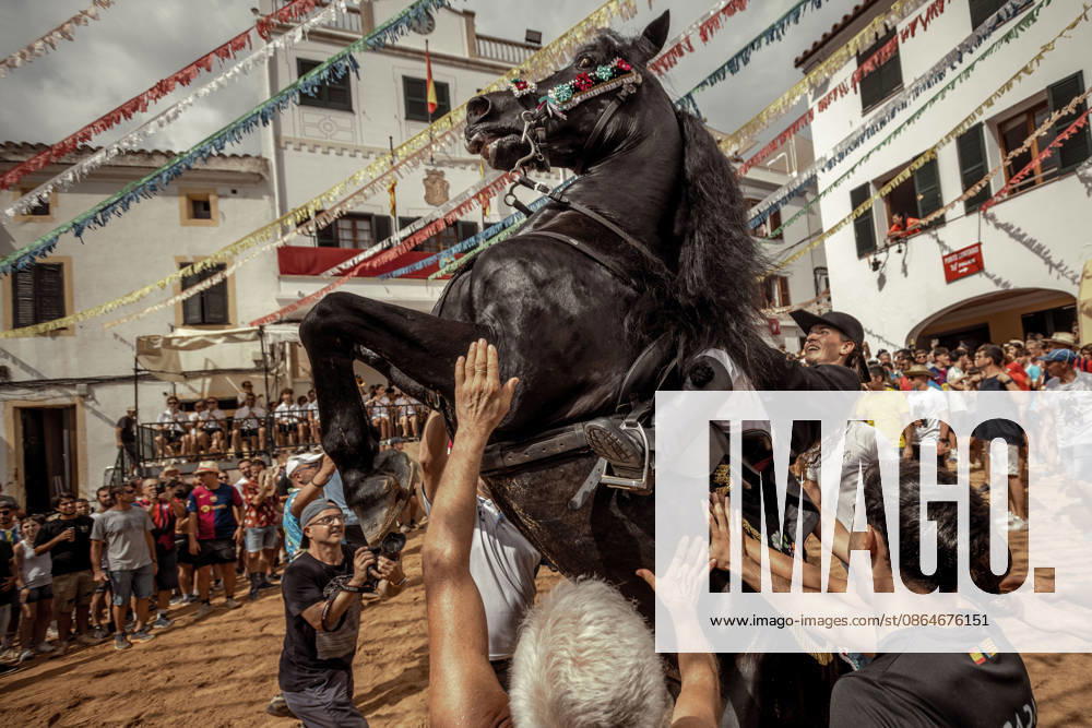 A caixer, or horse rider, rears his horse amid a cheering crowd during the traditional Jaleo at the Sant Bartomeu Festival in Ferreries. Ferreries Spain - ZUMAo105 20260824_fap_o105_037