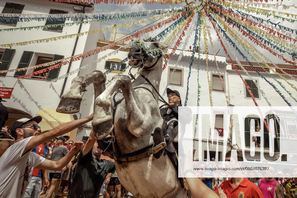 A caixer, or horse rider, rears his horse amid a cheering crowd during the traditional Jaleo at the Sant Bartomeu Festival in Ferreries. Ferreries Spain - ZUMAo105 20260824_fap_o105_018