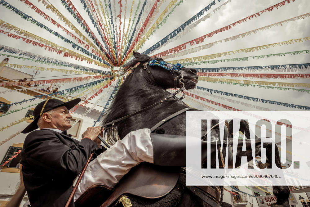 A caixer, or horse rider, rears his horse amid a cheering crowd during the traditional Jaleo at the Sant Bartomeu Festival in Ferreries. Ferreries Spain - ZUMAo105 20260824_fap_o105_021