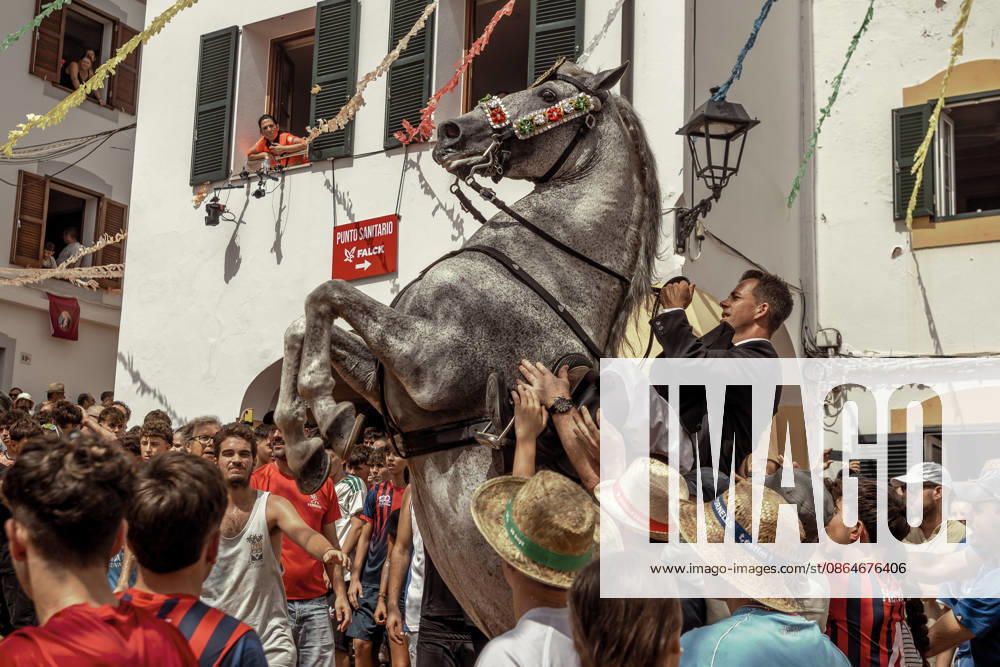 A caixer, or horse rider, rears his horse amid a cheering crowd during the traditional Jaleo at the Sant Bartomeu Festival in Ferreries. Ferreries Spain - ZUMAo105 20260824_fap_o105_022