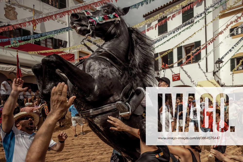 A caixer, or horse rider, rears his horse amid a cheering crowd during the traditional Jaleo at the Sant Bartomeu Festival in Ferreries. Ferreries Spain - ZUMAo105 20260824_fap_o105_028