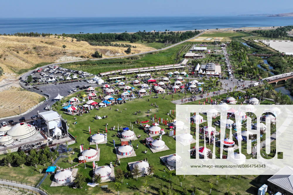 955th Anniversary of Malazgirt Victory in Bitlis, Turkiye BITLIS, TURKIYE - AUGUST 25: An aerial view shows crowds and traditional tents at Recep Tayyip Erdogan Ahlat National Garden during events marking the 955th anniversary of the Malazgirt Victory (Battle of Manzikert), on August 25, 2026 in Ahlat, Bitlis, Turkiye. The celebrations, held in the Carho area and centered around the Sultan Alparslan encampment, continued for a third day and drew residents as well as visitors from across the country. The 1071 Battle of Manzikert is widely regarded as a major turning point in Anatolian history, accelerating Turkic settlement in the region following the Seljuk victory over the Byzantine Empire. Ozkan Bilgin Anadolu Bitlis Turkey. Editorial u