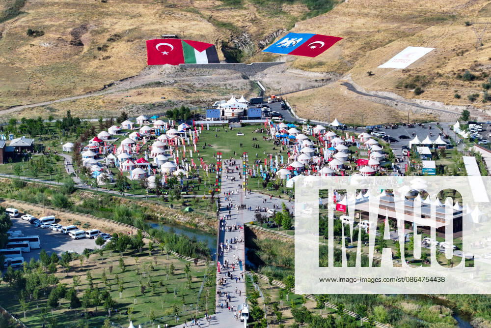 955th Anniversary of Malazgirt Victory in Bitlis, Turkiye BITLIS, TURKIYE - AUGUST 25: An aerial view shows crowds and traditional tents at Recep Tayyip Erdogan Ahlat National Garden during events marking the 955th anniversary of the Malazgirt Victory (Battle of Manzikert), on August 25, 2026 in Ahlat, Bitlis, Turkiye. The celebrations, held in the Carho area and centered around the Sultan Alparslan encampment, continued for a third day and drew residents as well as visitors from across the country. The 1071 Battle of Manzikert is widely regarded as a major turning point in Anatolian history, accelerating Turkic settlement in the region following the Seljuk victory over the Byzantine Empire. Ozkan Bilgin Anadolu Bitlis Turkey. Editorial u
