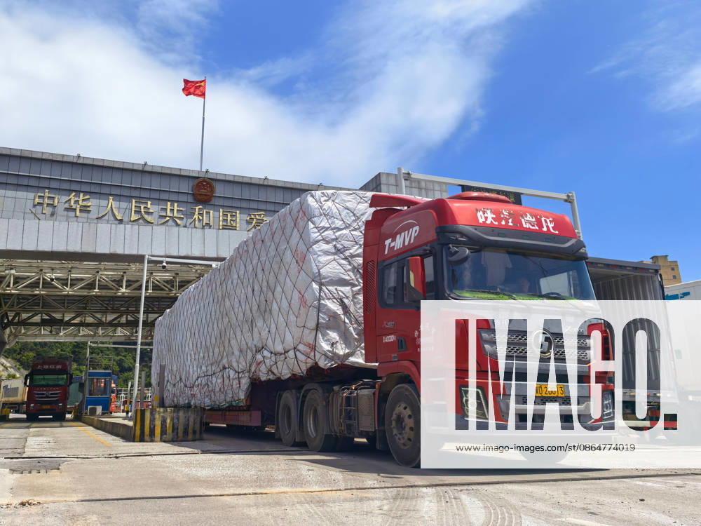 A truck drives away from the zero-kilometer marker at Aidian Port on August 25, 2026 in Ningming, Guangxi Zhuang Autonomous Region of China. Aidian Port suspended customs services on August 23 due to Typhoon Yinxing, and resumed operations on August 25 as damaged public facilities in Aidian Town were restored.