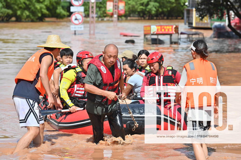 (260825) -- CHONGZUO, Aug. 25, 2026 -- Rescuers transfer stranded residents in Ningming County, Chongzuo City, south China s Guangxi Zhuang Autonomous Region, Aug. 25, 2026. Continuous heavy rainfalls caused by Typhoon Narra, the 19th typhoon of the year, have swept many areas in Ningming. Local authorities have fully engaged in rescue and relief efforts. As of 12:00 p.m. (Beijing Time) on Tuesday, 22,008 stranded civilians had been transferred. ) CHINA-GUANGXI-NINGMING-TYPHOON-STRANDED RESIDENTS-TRANSFER (CN) ZhouxHua
