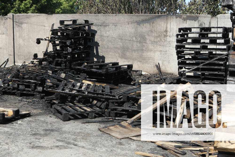 Burnt wooden pallets that caught fire as a result of a nighttime Russian UAV attack are in a parking lot near a shopping and entertainment centre in Dnipro, Ukraine, August 25, 2026. Fires broke out inside and near the shopping mall as a result of the Russian attack. (Photo by Mykola Miakshykov Ukrinform) Russian attack hits parking lot near shopping mall in Dnipro suburb