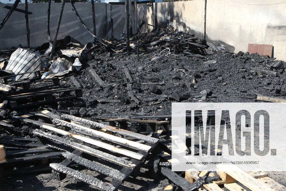 Burnt wooden pallets that caught fire as a result of a nighttime Russian UAV attack are in a parking lot near a shopping and entertainment centre in Dnipro, Ukraine, August 25, 2026. Fires broke out inside and near the shopping mall as a result of the Russian attack. (Photo by Mykola Miakshykov Ukrinform) Russian attack hits parking lot near shopping mall in Dnipro suburb