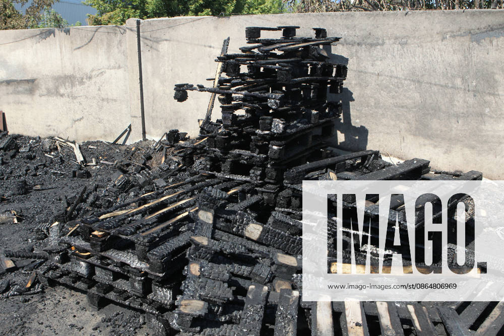 Burnt wooden pallets that caught fire as a result of a nighttime Russian UAV attack are in a parking lot near a shopping and entertainment centre in Dnipro, Ukraine, August 25, 2026. Fires broke out inside and near the shopping mall as a result of the Russian attack. (Photo by Mykola Miakshykov Ukrinform) Russian attack hits parking lot near shopping mall in Dnipro suburb